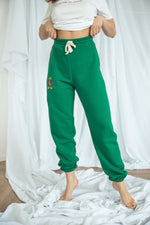 Load image into Gallery viewer, Spodnie dresowe damskie PUMPY SNAKE - zielony - Chiara Wear
